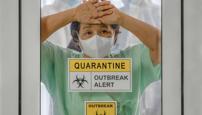 covid-19 infected patient in quarantine room with quarantine and covid-19 infected patient in quarantine room with quarantine and breakout alert sign at hospital with blurred disease control experts inside
